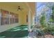 Screened porch with ceiling fan and view of backyard at 19247 Sw 98Th Loop, Dunnellon, FL 34432