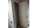 Bathroom closet with shelving and a white door at 19950 Ibis Ct, Dunnellon, FL 34432