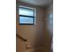 Bathroom view features a small window and grab bar at 19950 Ibis Ct, Dunnellon, FL 34432