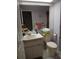 Bathroom with toilet, sink, and shower at 19950 Ibis Ct, Dunnellon, FL 34432