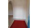 Inviting foyer with a red rug, tile flooring, and arched doorway leading to other rooms at 19950 Ibis Ct, Dunnellon, FL 34432