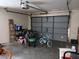 Garage with bicycles, tools and storage items at 19950 Ibis Ct, Dunnellon, FL 34432