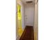 Hallway with access to the laundry room and storage space at 19950 Ibis Ct, Dunnellon, FL 34432