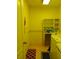 Laundry room with yellow walls and tile flooring at 19950 Ibis Ct, Dunnellon, FL 34432