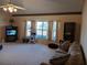 Bright living room with bay window, cat tree, and ample space at 19950 Ibis Ct, Dunnellon, FL 34432