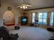 Spacious living room with carpeted floors and bay window at 19950 Ibis Ct, Dunnellon, FL 34432