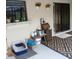 View of an outdoor patio area featuring storage, plants, and sliding door for outdoor living at 19950 Ibis Ct, Dunnellon, FL 34432