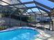 Large, screened-in pool with ample space for relaxation at 19950 Ibis Ct, Dunnellon, FL 34432