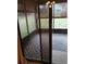 View of screened-in sunroom featuring attractive geometric rug and natural light at 19950 Ibis Ct, Dunnellon, FL 34432