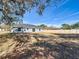 View of home from the backyard, showcasing its gray exterior at 201 Locust Rd, Ocala, FL 34472