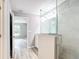 Modern bathroom features tile floors, updated lighting, a vanity, and a glass shower at 201 Locust Rd, Ocala, FL 34472