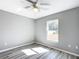 Spacious bedroom with window and ceiling fan at 201 Locust Rd, Ocala, FL 34472