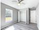 Bedroom featuring a large window and ceiling fan at 201 Locust Rd, Ocala, FL 34472