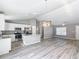 Open kitchen and living room area with plenty of natural light at 201 Locust Rd, Ocala, FL 34472