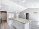 Kitchen island with pendant lighting, and stainless steel appliances at 201 Locust Rd, Ocala, FL 34472