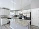 Modern kitchen featuring granite countertops and stainless steel appliances at 201 Locust Rd, Ocala, FL 34472