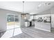 Updated kitchen with an island, stainless appliances, and access to the backyard at 201 Locust Rd, Ocala, FL 34472