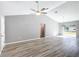 Spacious living area with vinyl plank flooring and access to backyard at 201 Locust Rd, Ocala, FL 34472