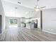 Open floor plan showcasing living room, dining area and kitchen with modern finishes at 201 Locust Rd, Ocala, FL 34472