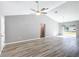 Large, open living room with vaulted ceiling and sliding glass doors at 201 Locust Rd, Ocala, FL 34472