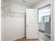 Walk-in closet with shelving and access to the attached modern bathroom at 201 Locust Rd, Ocala, FL 34472
