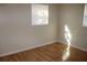 Bright bedroom with wood flooring and window coverings at 21465 Sw Honeysuckle St, Dunnellon, FL 34431