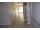 Hallway with tile floors and neutral walls at 21465 Sw Honeysuckle St, Dunnellon, FL 34431