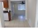 Kitchen with view into dining area and tile floors at 21465 Sw Honeysuckle St, Dunnellon, FL 34431