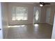 Living room with tile floor and window blinds at 21465 Sw Honeysuckle St, Dunnellon, FL 34431