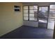 Cozy screened porch with concrete flooring at 21465 Sw Honeysuckle St, Dunnellon, FL 34431