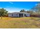 Large backyard with screened patio and wooden fence at 24 Pine Course Pl, Ocala, FL 34472