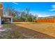 Spacious backyard with wooden fence and lush grass at 24 Pine Course Pl, Ocala, FL 34472