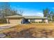 Single-story home with attached garage and yard at 24 Pine Course Pl, Ocala, FL 34472