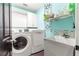 Laundry room with washer, dryer, and utility sink at 24 Pine Course Pl, Ocala, FL 34472