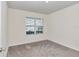 Bright bedroom with neutral walls and carpet at 27 Hickory Course Ln, Ocala, FL 34472