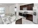 Modern kitchen with granite countertops and stainless steel appliances at 27 Hickory Course Ln, Ocala, FL 34472