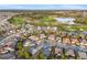 An aerial shot displaying a neighborhood with a beautiful golf course and a shimmering lake at 3690 Nw 56Th Ave, Ocala, FL 34482