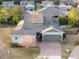 Aerial view showcasing the home's front exterior, driveway, and well-maintained landscaping at 3690 Nw 56Th Ave, Ocala, FL 34482