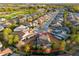 Aerial view of a neighborhood with a golf course and mature trees surrounding the homes at 3690 Nw 56Th Ave, Ocala, FL 34482