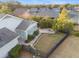 Aerial view of backyard featuring patio with fire pit and a black metal fence at 3690 Nw 56Th Ave, Ocala, FL 34482