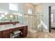 Bright bathroom shower with neutral tilework, a glass surround, and a built in bench at 3690 Nw 56Th Ave, Ocala, FL 34482