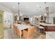 Open floor plan dining room seamlessly transitioning into the living room and modern kitchen at 3690 Nw 56Th Ave, Ocala, FL 34482