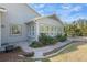 Exterior view of the home showing windows and green landscaping at 3690 Nw 56Th Ave, Ocala, FL 34482