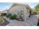 Exterior view of the home showing windows and a covered patio area at 3690 Nw 56Th Ave, Ocala, FL 34482