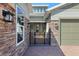 Close up view of a well-appointed front porch with stone accents and manicured landscaping at 3690 Nw 56Th Ave, Ocala, FL 34482