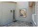 Outdoor patio with neutral colored pavers and a exterior door with a window at 3690 Nw 56Th Ave, Ocala, FL 34482