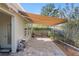 Outdoor patio with retractable awning and fenced in backyard at 3690 Nw 56Th Ave, Ocala, FL 34482