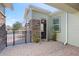 View of a door on a tile patio with stone accents and manicured landscaping at 3690 Nw 56Th Ave, Ocala, FL 34482