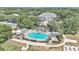 Resort-style community with pool, clubhouse, and tennis courts at 3923 Manor Oaks Ct, Leesburg, FL 34748