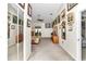 Main bedroom with carpet flooring, ceiling fan and access to walk-in closet at 3923 Manor Oaks Ct, Leesburg, FL 34748